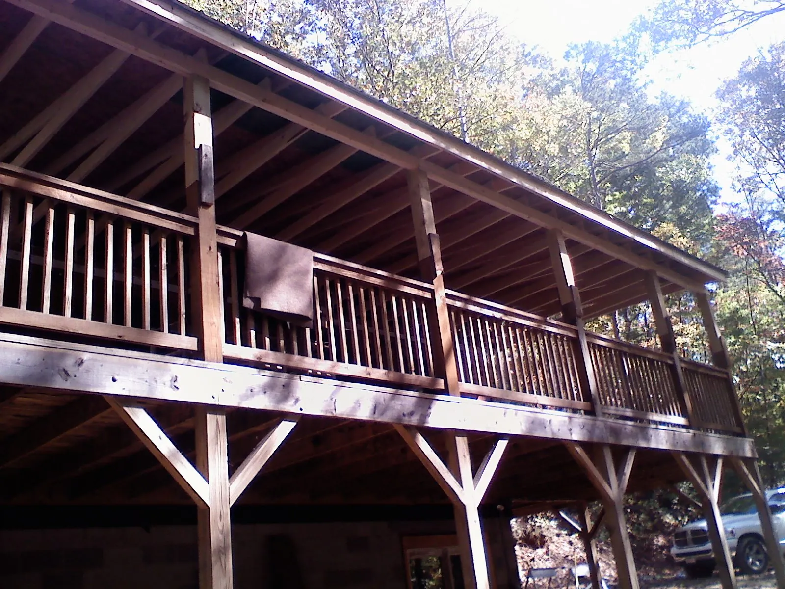 Timber framing under a new elevated porch and deck — Roof Leak Repair in Columbia Falls by Roofing Brothers
